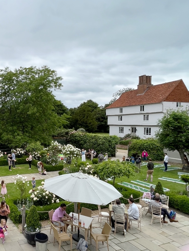 aerial shot of manor house with garden games