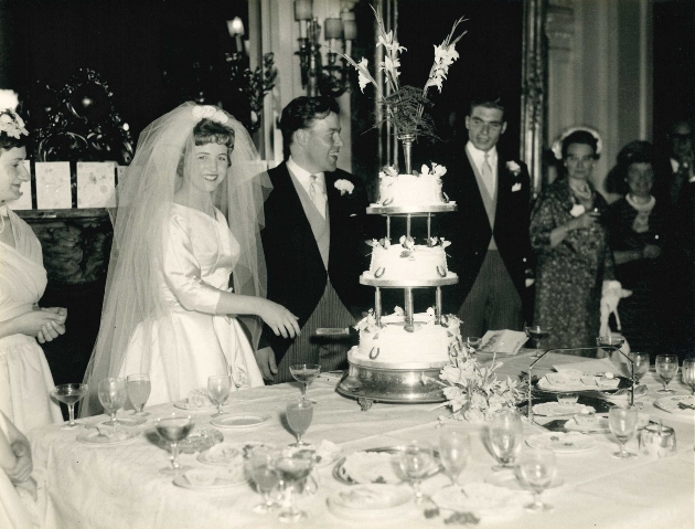 Bride and Groom cutting wedding cake