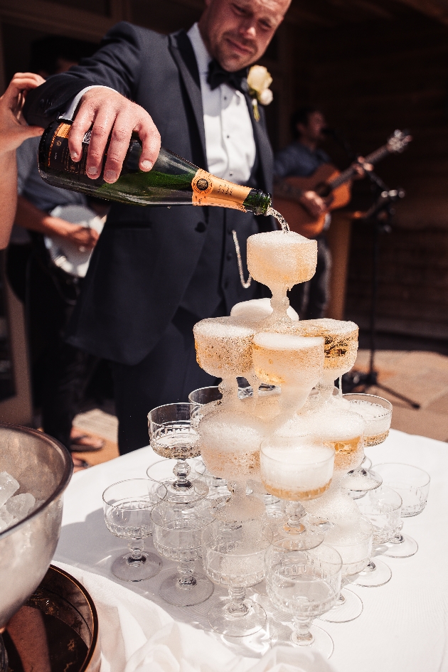 Bride and groom with a champagne tower