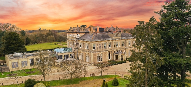 exterior of grand wedding venue at sunset