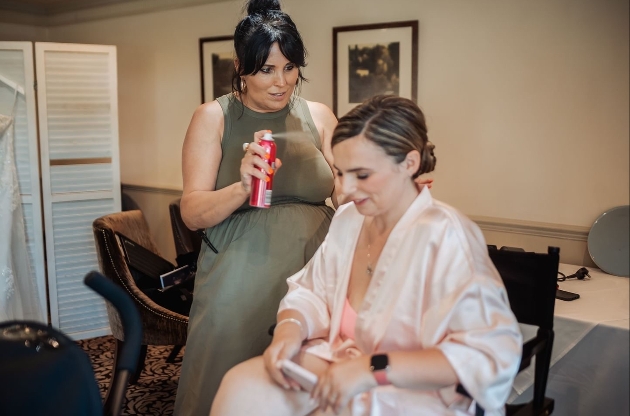 linzi doing hair on a bride