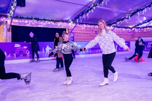 mother and daughter ice skating